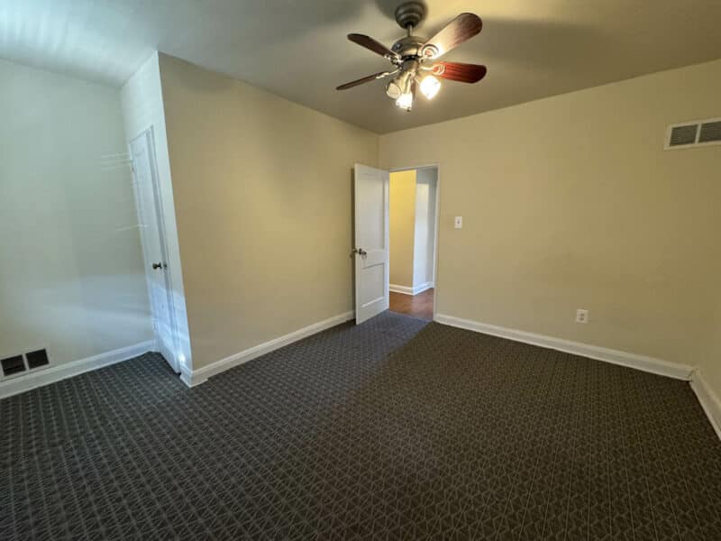 Second bedroom at 2808 Windsor Avenue with patterned carpet and ceiling fan.