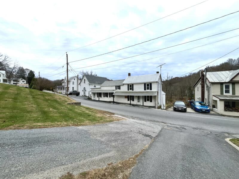 Distant wide shot of the Finksburg home and surrounding properties along Patapsco Road.