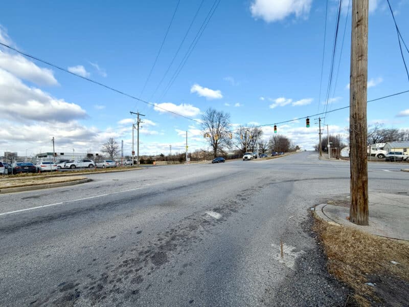 Utility poles and roadway access near E. Monument Street commercial properties