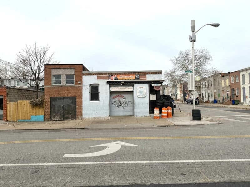 Automotive building at 300 S. Carey Street in Southwest Baltimore on a corner lot with roll-up doors