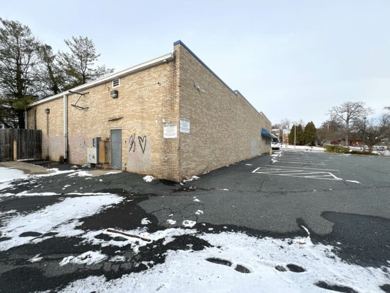 Rear exterior of retail building at 3615 E. Northern Parkway with service access.