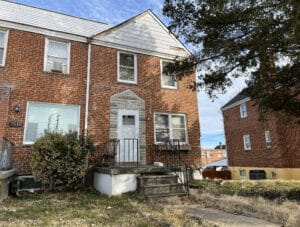 End-of-group two-story brick townhome at 7512 School Avenue in Dundalk’s Eastfield neighborhood