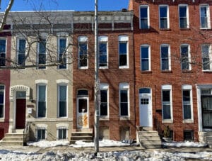 Front exterior of 1326 N. Fulton Avenue, two-story brick shell townhome in Sandtown-Winchester, Baltimore City