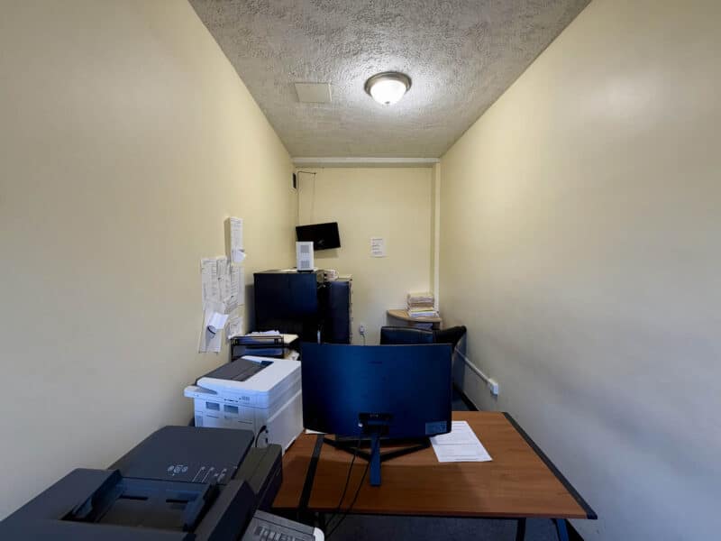 Small office or workroom with desk and equipment inside McCabe Mansion Baltimore