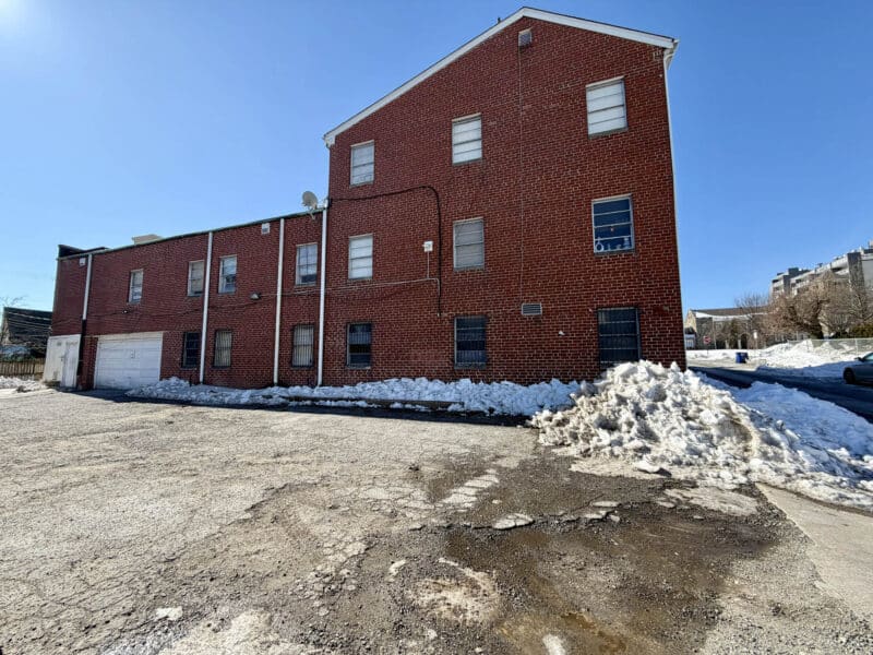 Rear view of McCabe Mansion with garage entrance