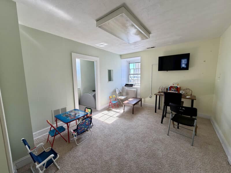 Multi-purpose office room with children’s table and workstations
