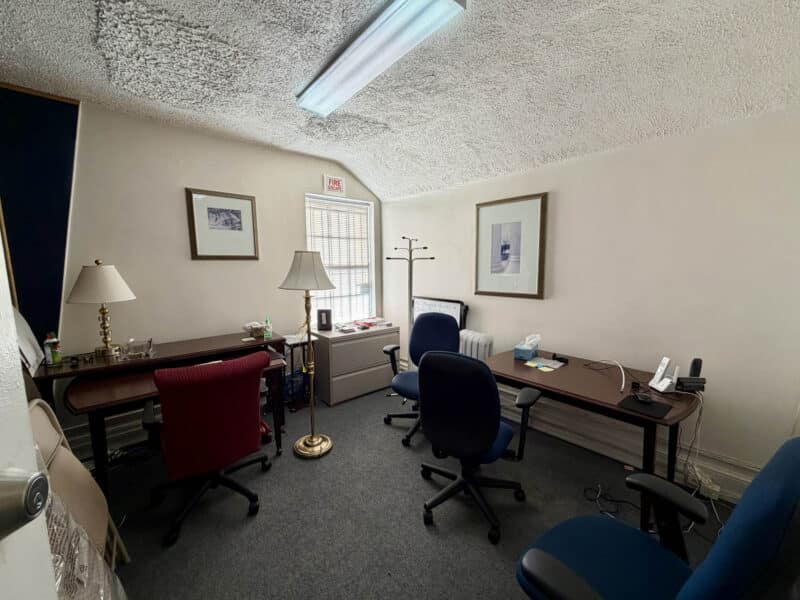 Private office with multiple desks and workstations