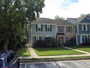 Front exterior view of end-of-group townhouse at 18 Softwinds Court in the Pleasant Hills community of Owings Mills Maryland