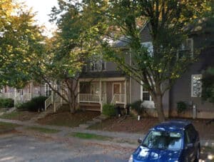 Front exterior view of two-story townhouse at 9317 Town Place Drive in the Five Oaks community of Owings Mills Maryland