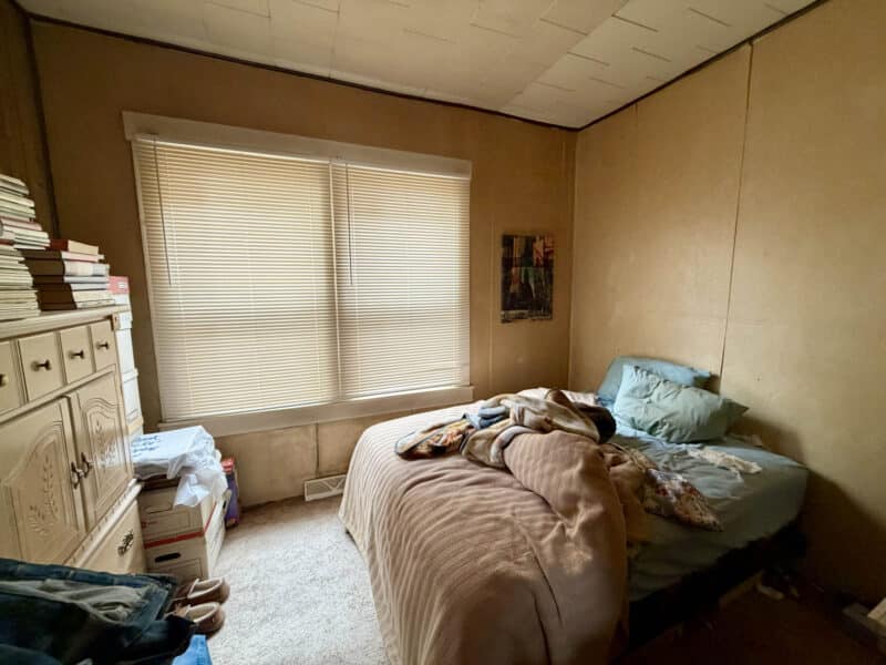 Bedroom with window, carpet flooring, and closet space in 8226 Fort Smallwood apartment unit