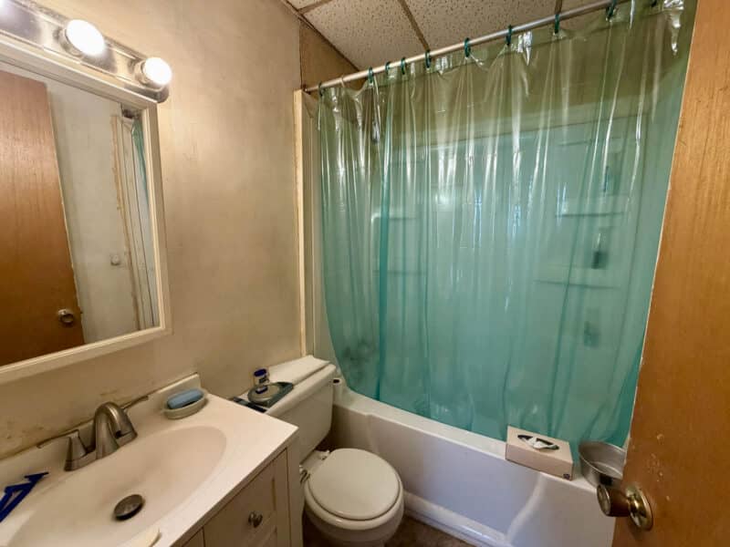 Bathroom with vanity, toilet, and tub shower combination in apartment unit at 8226 Fort Smallwood