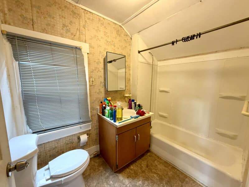 Bathroom with vanity, toilet, and tub shower combination in apartment unit at 8226 Fort Smallwood Road