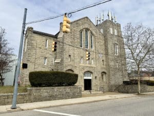Stone church building with tower and arched windows on Belair Road in Baltimore