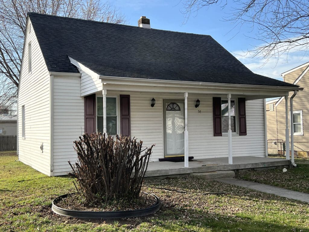 Porchfront bungalow at 54 Riverside Road in Essex MD with covered front porch and vinyl siding
