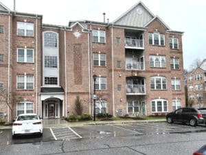 Windsor at Perry Hall Farms condominium building exterior at 4501-P Talcott Terrace with brick facade and parking area