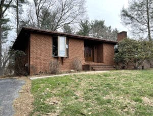 Brick rancher with front lawn and entry steps in Mt. Hebron Ellicott City