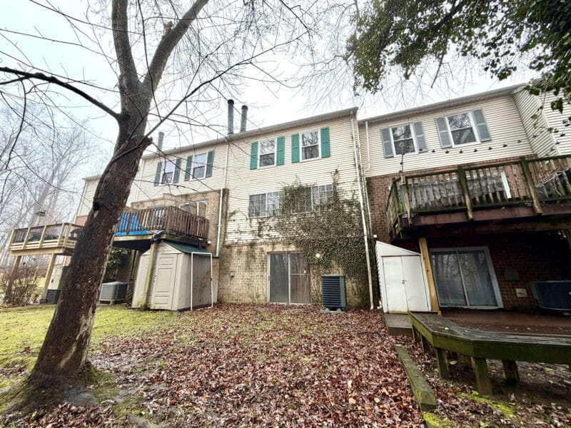Rear exterior of Ellicott Mills townhome with walkout basement at 12 Island Run Court Catonsville MD