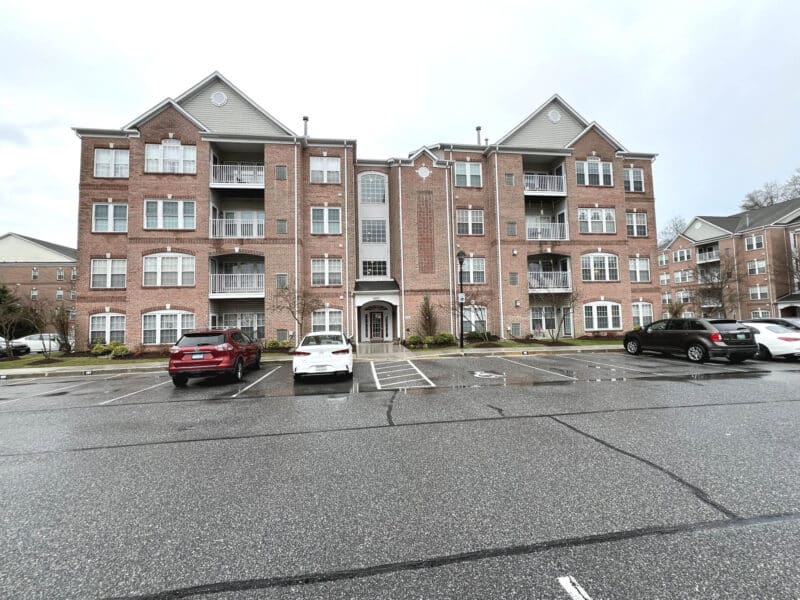 Wide exterior view of Windsor at Perry Hall Farms condo building in Perry Hall MD with multiple balconies