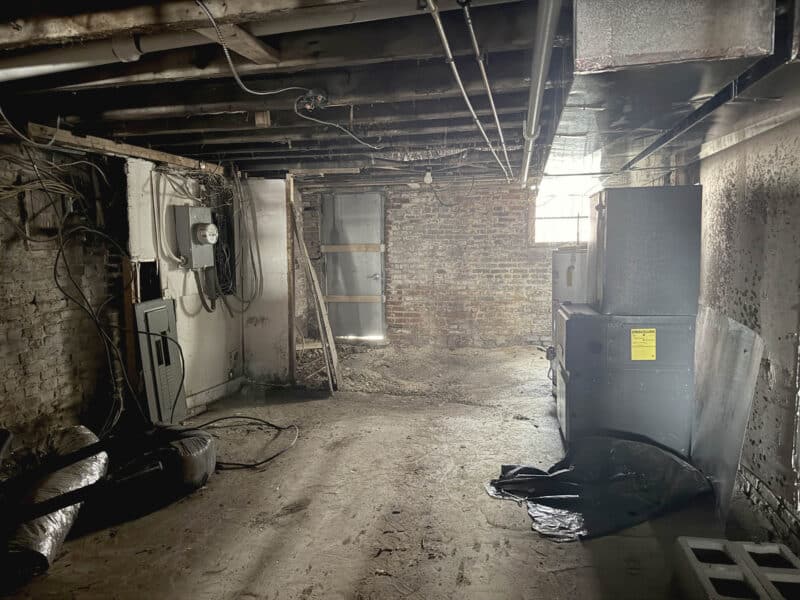 Utility room with HVAC equipment and electrical systems in mixed-use building