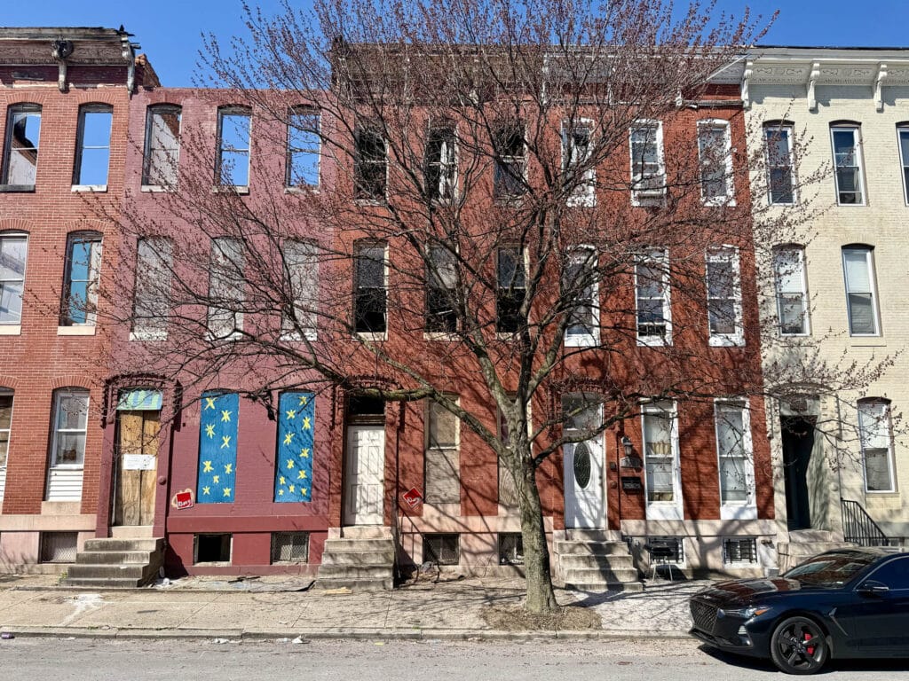 Three story brick shell townhome at 736 North Fulton Avenue in Harlem Park Baltimore