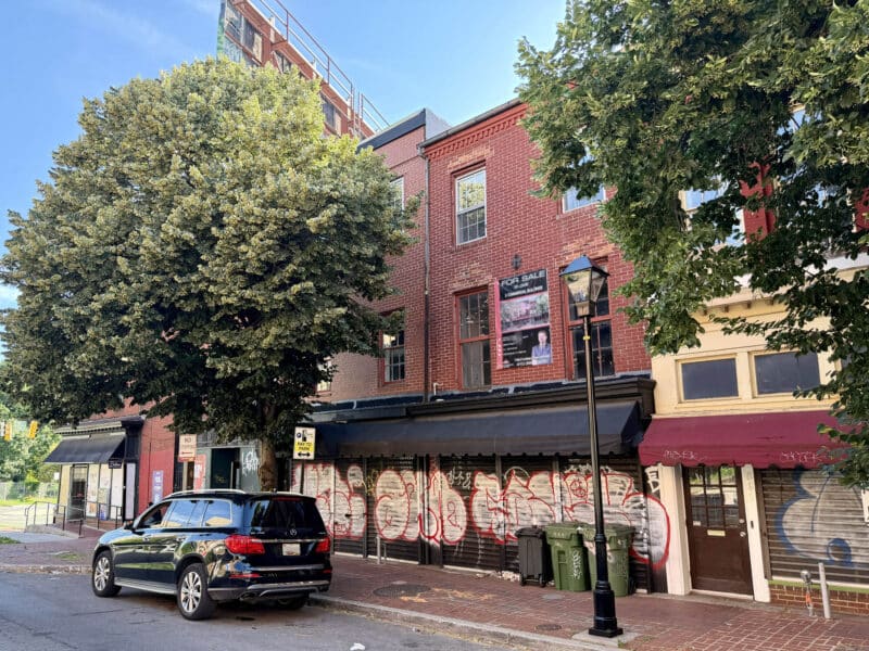 Streetscape view of adjoining storefront buildings on North Howard Street in the Mount Vernon neighborhood of Baltimore.