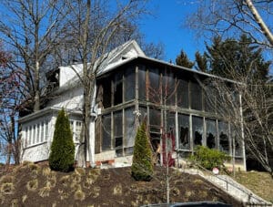 Front exterior of fire-damaged three-story traditional home at 500 E. 42nd Street in Baltimore's Pen Lucy neighborhood.