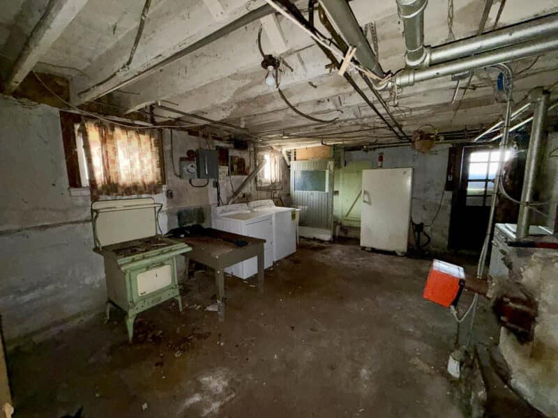 Unfinished basement with laundry area and mechanical systems at 238 Baltimore Avenue