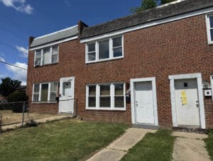 Front exterior of 3040 Elizabeth Avenue, a two story brick townhome in Baltimore's Lakeland neighborhood.
