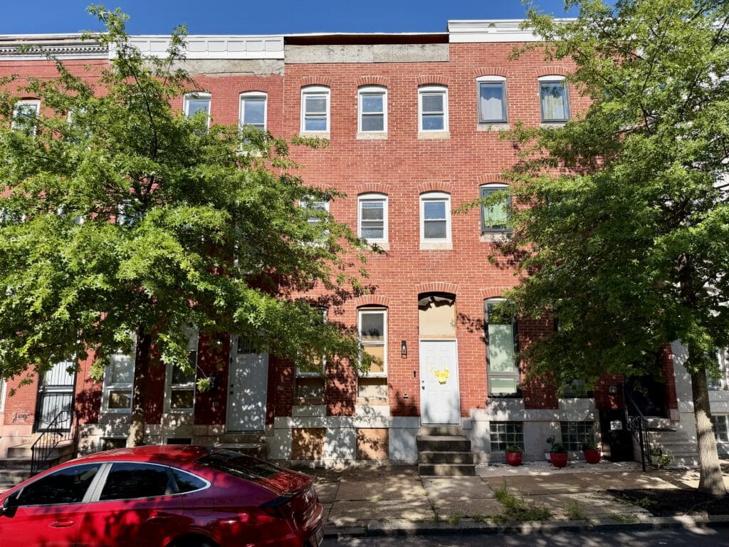 Front exterior of three-story brick townhome at 1522 N. Broadway in the Oliver neighborhood of Baltimore City.