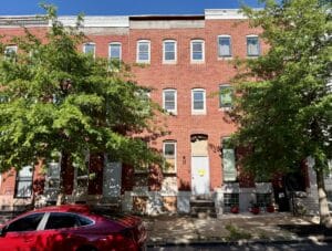 Front exterior of three-story brick townhome at 1522 N. Broadway in the Oliver neighborhood of Baltimore City.