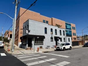 Exterior of 3734 Fleet Street, a two-story corner bar and restaurant building at S. Eaton Street in Brewers Hill, Baltimore.