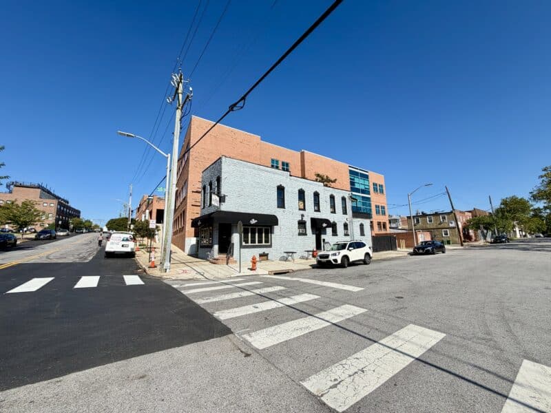 Wide exterior view of 3734 Fleet Street at Fleet and S. Eaton Streets in Brewers Hill, Baltimore City.
