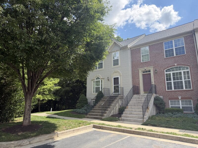Exterior view of 1213 Corolla Court and neighboring townhouse condominium units in Catonsville Mews.