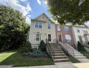 Front exterior of 1213 Corolla Court, an end-of-group townhouse condominium in Catonsville Mews, Catonsville, Maryland.