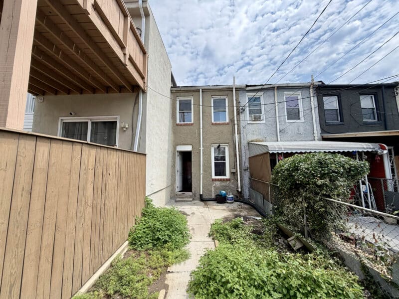 Rear exterior with fenced yard at 1222 Bayard Street townhome in Washington Village/Pigtown Baltimore