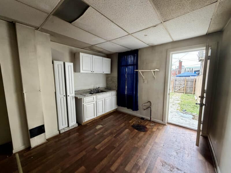Kitchen area with rear yard access at 1222 Bayard Street Baltimore investment property