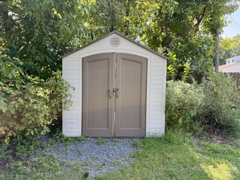 Outdoor storage shed located in the backyard of Cape Cod home.