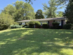 Brick ranch home at 2313 Pot Spring Road in Timonium, Maryland, on a landscaped 0.68-acre lot.