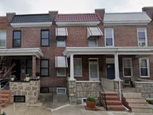 Brick porchfront townhome at 721 Grundy Street in Brewers Hill, Baltimore, Maryland